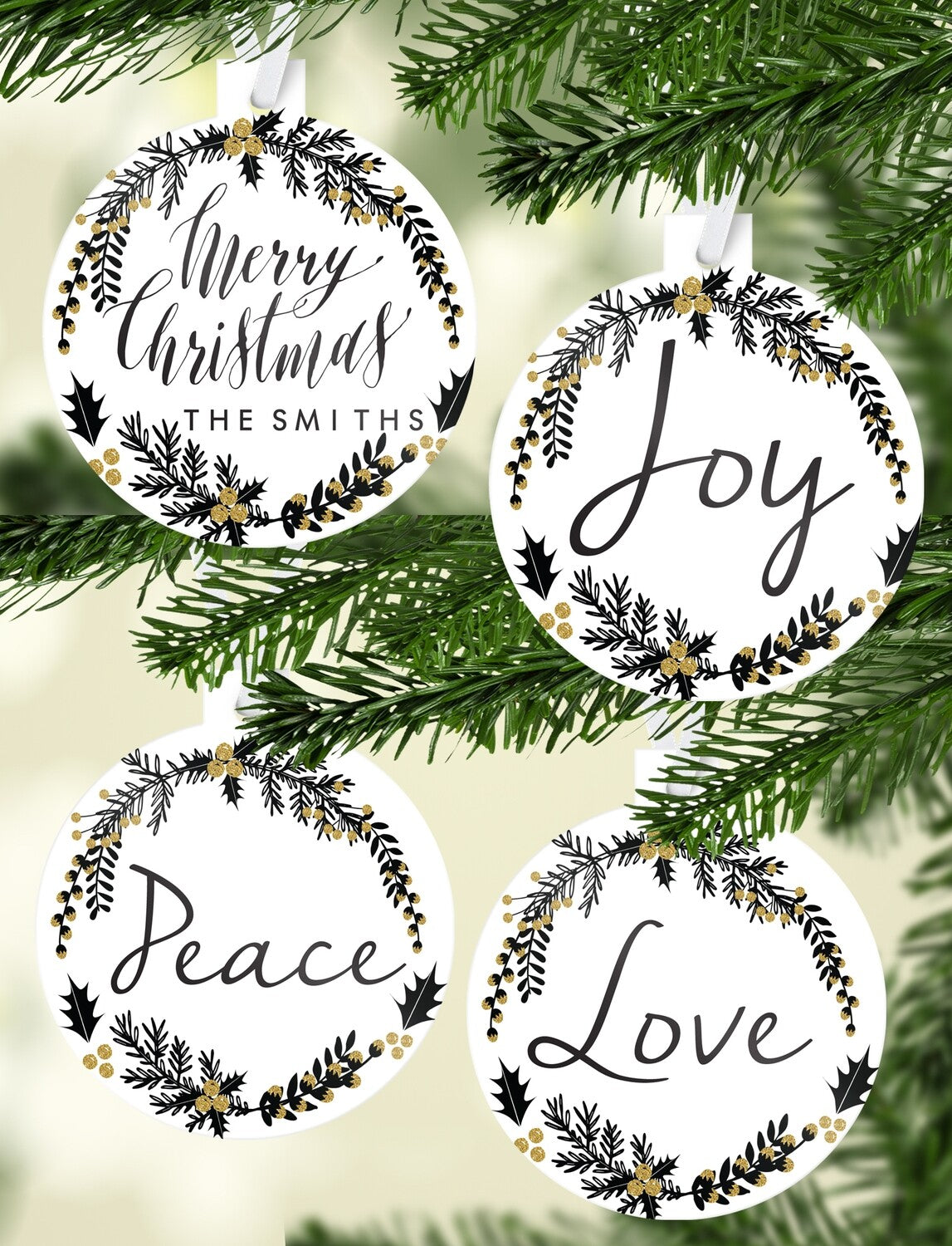 Black & Gold Wreath Christmas Bauble Set "Merry Christmas The Smiths" from Happy Look | South Africa – A set of four circular white ornaments with a black wreath and gold glitter accents. The set features holiday words in script: "Merry Christmas THE SMITHS," "Joy," "Peace," and "Love."
