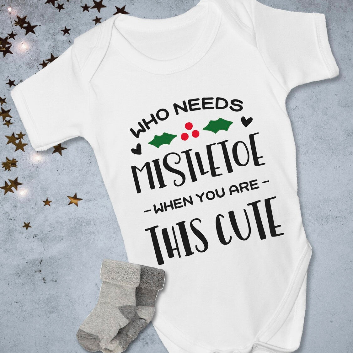 Personalised "Who Needs Mistletoe When You Are This Cute" bodysuit from Happy Look | South Africa – charming design for the cutest holiday look. Perfect for family gatherings and customisable with names. A thoughtful gift that brings joy and lasting memories. Shop now!