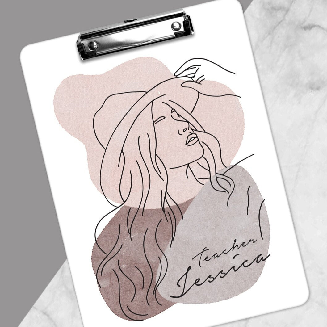 Personalised PU Leather Clipboard from Happy Look | South Africa – A workspace setup featuring a stylish clipboard with a professionally printed name and design, adding a personal touch. Perfect for teachers, executives, and gift-giving, and customisable with personalised text or artwork. A thoughtful gift that brings joy and lasting memories. Shop now!