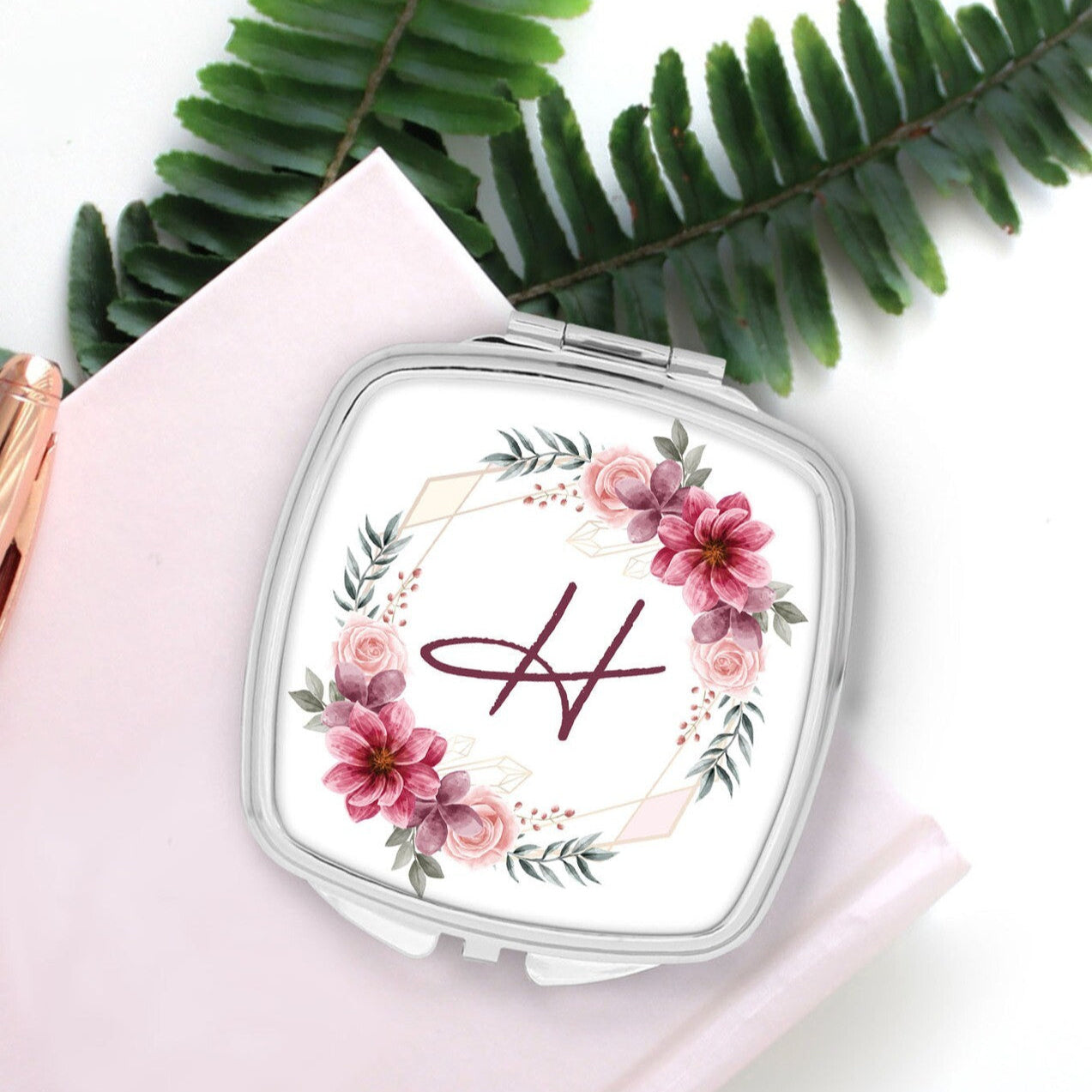 Personalised Pocket Mirror from Happy Look | South Africa β Embellished with florals and the monogram "H" on the top. Perfect for bridesmaids and customisable with initials. A thoughtful gift that brings joy and lasting memories. Shop now!