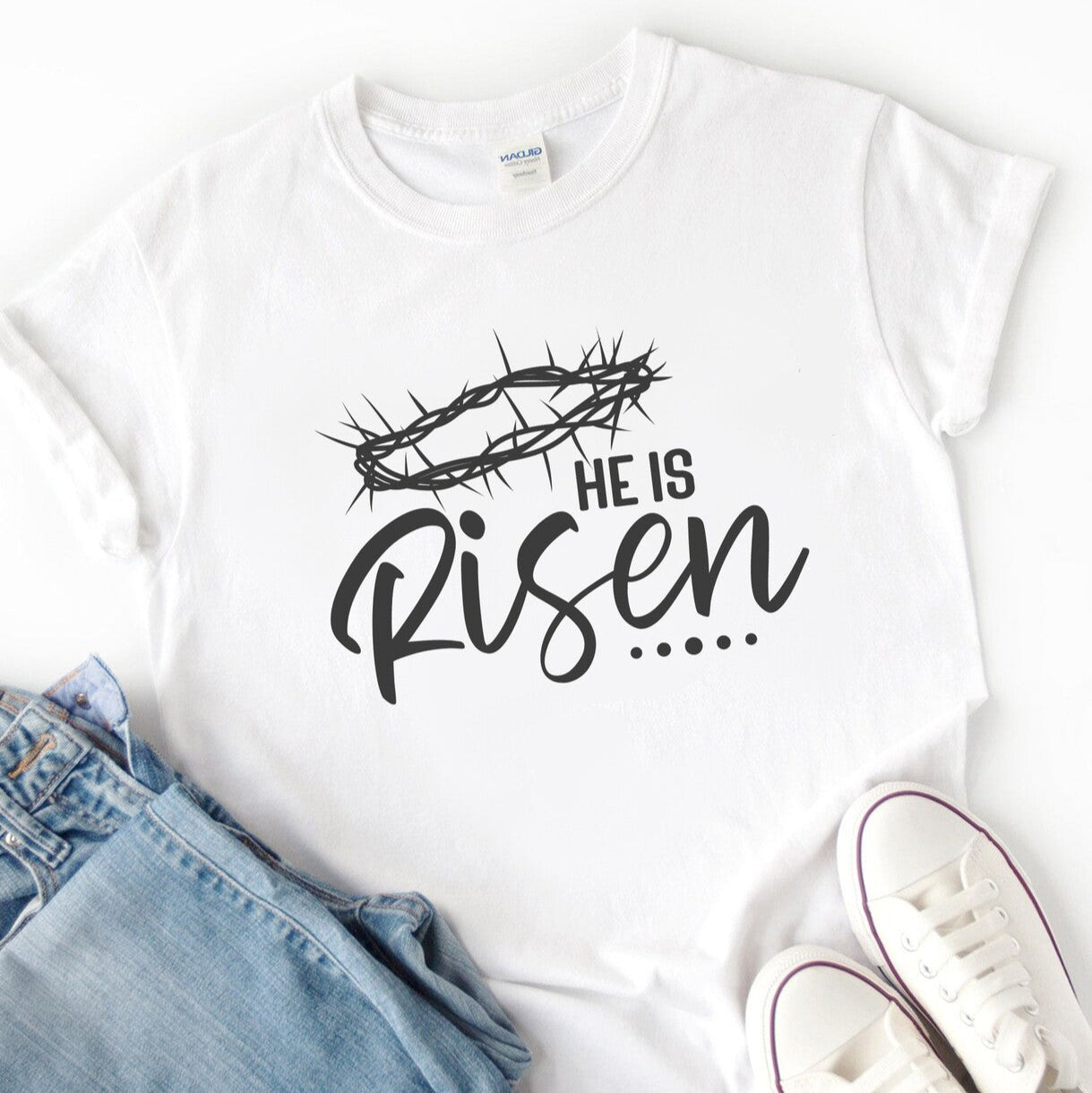 Personalised He Is Risen T-Shirt from Happy Look | South Africa β Showcasing a significant Easter message with a crown of thorns. Perfect for Easter services and customisable with your choice of name. A thoughtful gift that brings joy and lasting memories. Shop now!