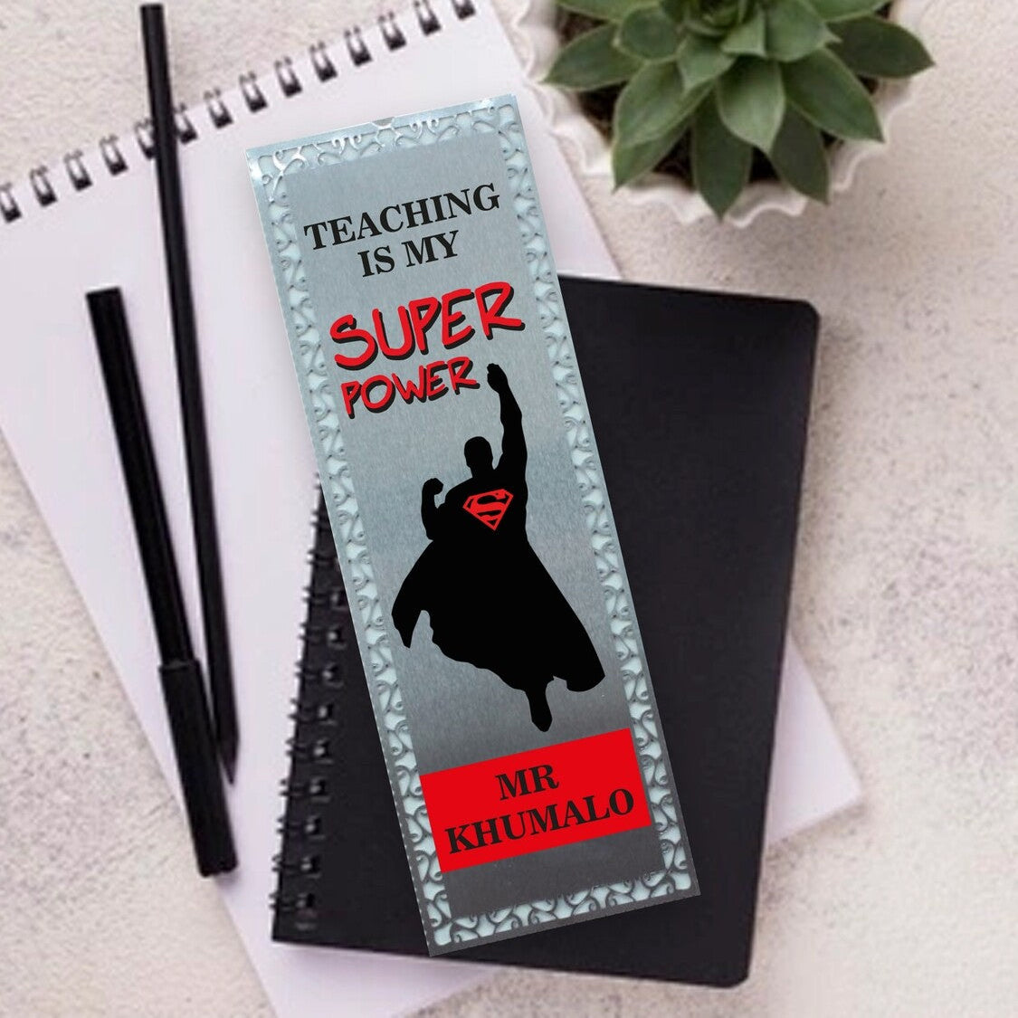 Personalised Metal Bookmark from Happy Look | South Africa – Celebrates teaching as a superpower. Perfect for Teacher Appreciation gifts and customisable with a name. A thoughtful gift that brings joy and lasting memories. Shop now!