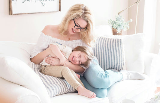 Mom enjoying Mother's Day in South Africa with her personalised gifts – Custom glass clocks, pamper sets, tote bags, and engraved keepsakes for the perfect heartfelt Mother's Day surprise.