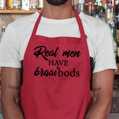 Personalised apron from Happy Look | South Africa – A fun red apron with the phrase "Real men HAVE braai'bods". Perfect for a humorous touch at family gatherings and BBQs, and customisable with personal messages. A thoughtful gift that brings joy and lasting memories. Shop now!