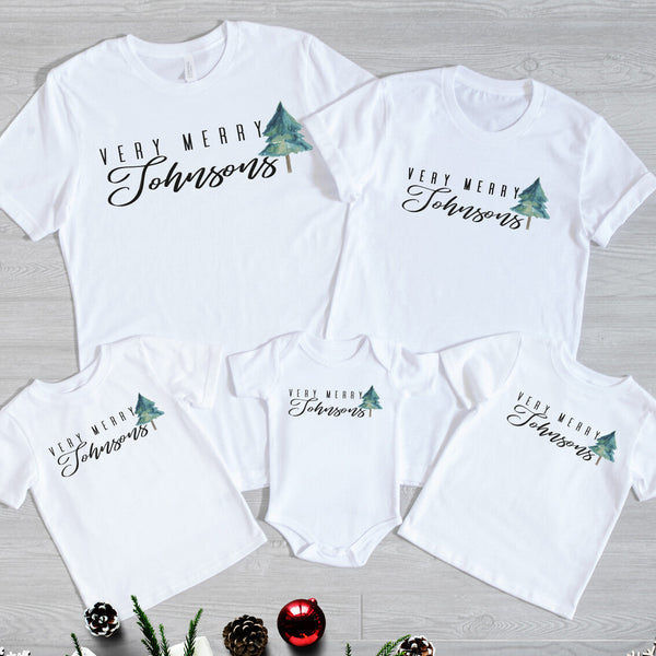 Very Merry Family Christmas Shirts from Happy Look | South Africa – Custom matching family t-shirts and baby grow with “Very Merry Johnsons” and a watercolor-style Christmas tree design. A heartfelt holiday outfit for families who love creating festive memories together. Perfect for Christmas photos, gatherings, and thoughtful personalised gifts.