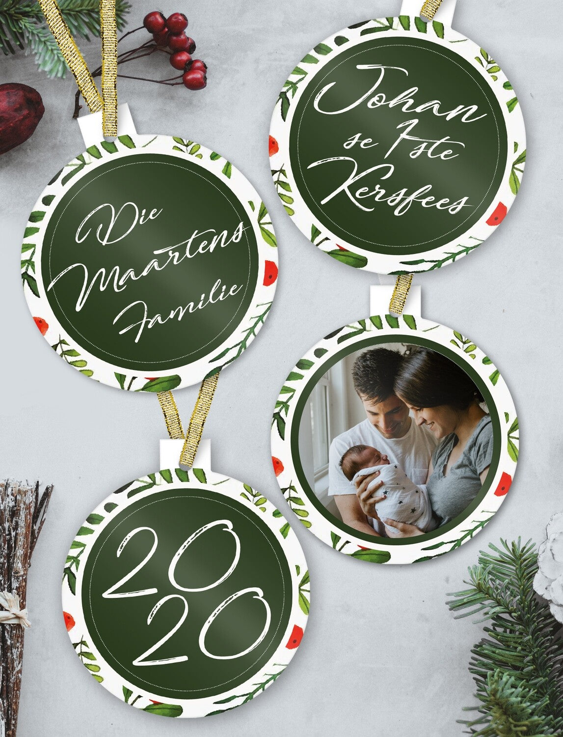 Afrikaans Christmas Bauble Set "Die Martens Familie / Johan se 1ste Kersfees" from Happy Look | South Africa – A set of four hanging circular ornaments with a dark green center and a festive watercolor wreath border. The set includes a family photo, "Die Martens Familie," "Johan se 1ste Kersfees," and "2020."