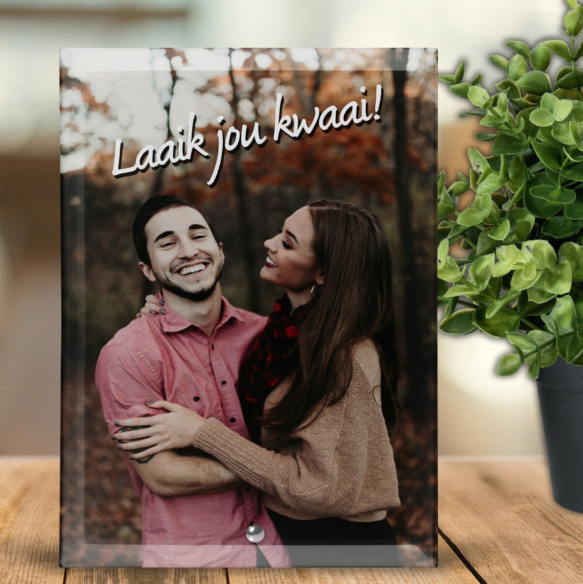Custom Photo Glass Block "Laaik jou kwaai!" (I like you fiercely) from Happy Look | South Africa – A rectangular glass block featuring a smiling couple embracing in a forest setting, overlaid with the Afrikaans text "Laaik jou kwaai!" in white script.