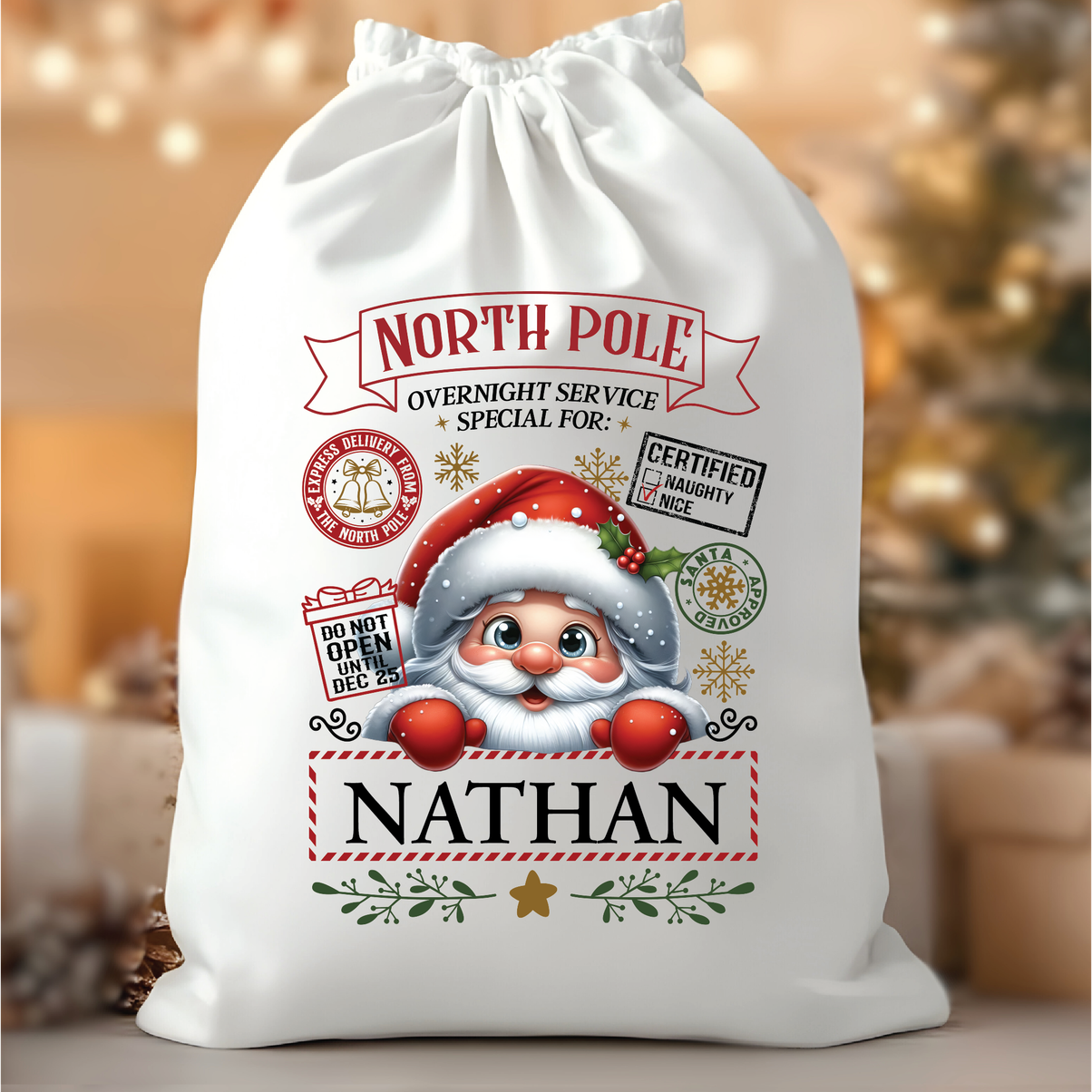 Personalised North Pole Santa Sack "Nathan" Certified Naughty/Nice from Happy Look | South Africa – A large white drawstring Christmas gift bag with a vintage North Pole delivery stamp design, a cartoon Santa peering out, and the personalized name "NATHAN."