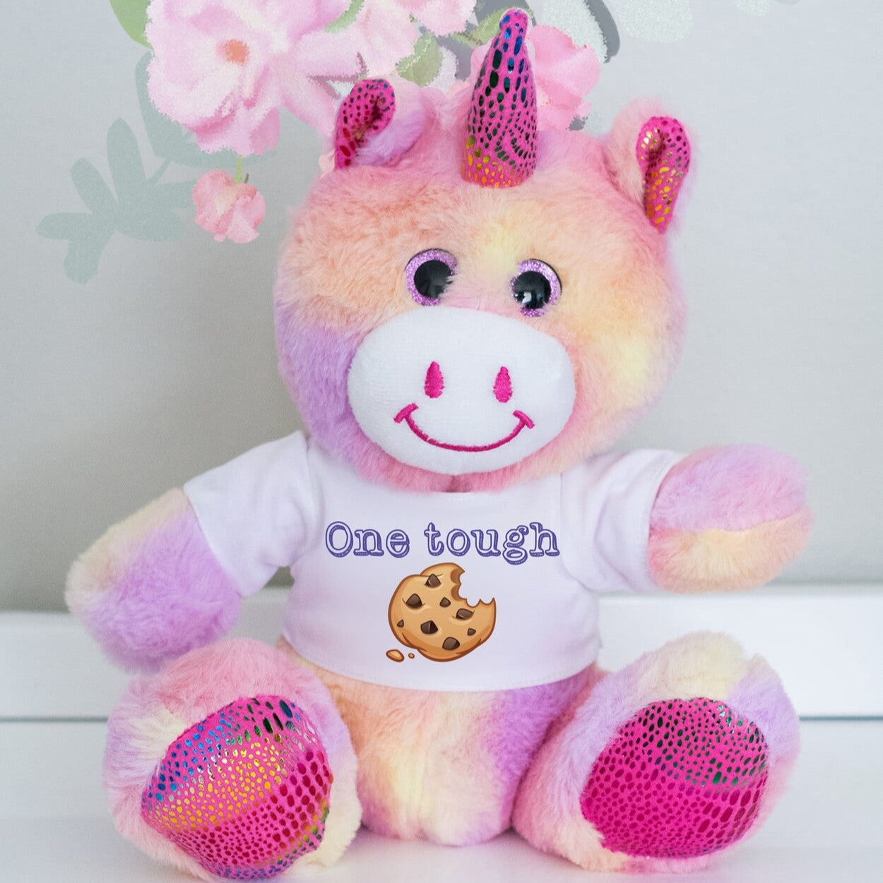 Personalised Unicorn Teddy from Happy Look | South Africa – Showcases a t-shirt with "One tough" and a cookie graphic.
Perfect for motivation or encouragement gifts and customisable with a name or personalisation. A thoughtful gift that brings joy and lasting memories. Shop now!