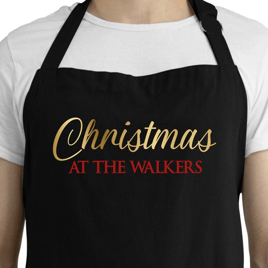 Personalised Apron from Happy Look | South Africa – Displays "Christmas AT THE WALKERS" in stylish lettering. Perfect for Christmas celebrations and customisable with a family name. A thoughtful gift that brings joy and lasting memories. Shop now!