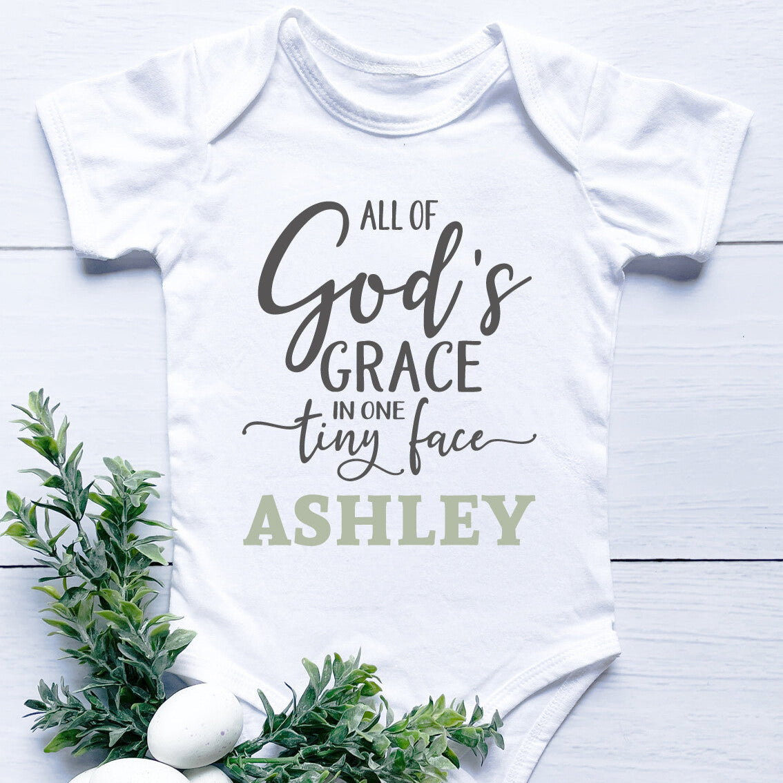 Personalised Grace Onesie from Happy Look | South Africa – Features heartfelt wording, "All of God's grace in one tiny face," along with a name. Perfect for baby showers and customisable with names. A thoughtful gift that brings joy and lasting memories. Shop now!