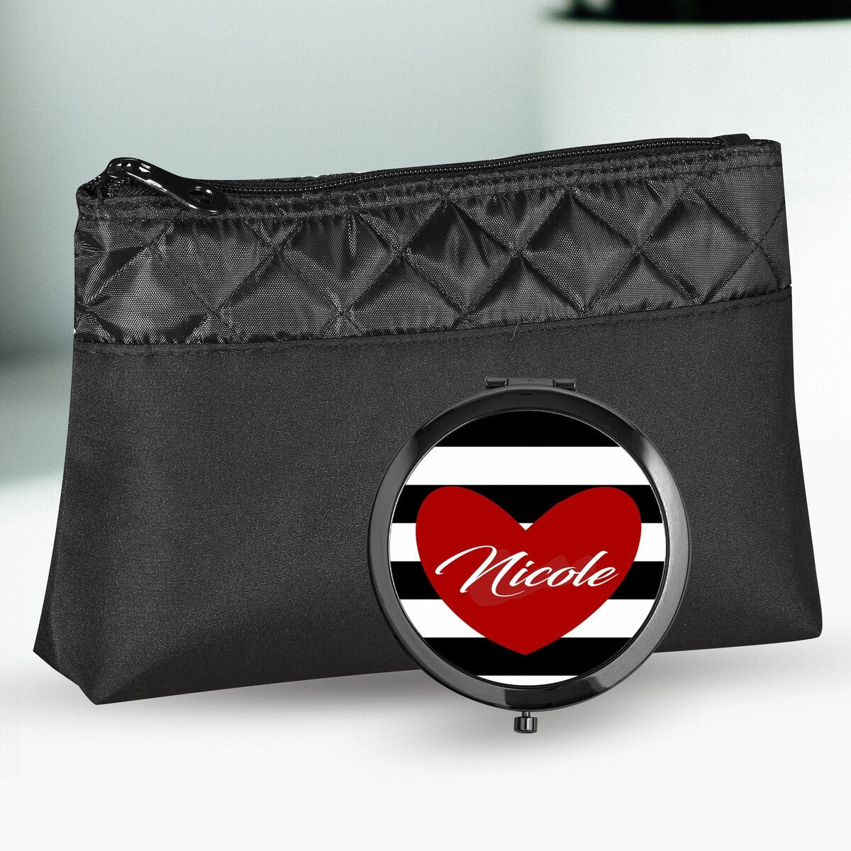 Personalised Cosmetic Bag and Mirror Set from Happy Look | South Africa – Chic black design accented with red heart graphics and a name feature. Perfect for anniversaries and customizable with personal names. A thoughtful gift that brings joy