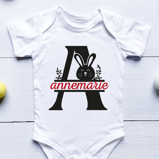 Personalised A Onesie from Happy Look | South Africa – Displays an elegant letter "A" alongside a cute bunny illustration with the name "annemarie." Perfect for any occasion and customisable with names. A thoughtful gift that brings joy and lasting memories. Shop now!