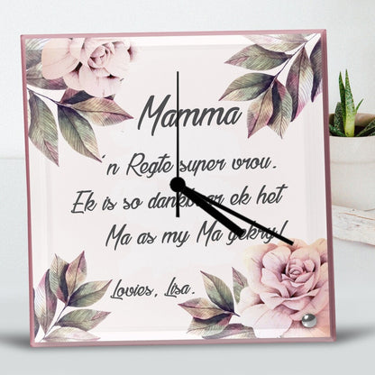 Square Glass Clock with a floral design and Afrikaans words, expressing gratitude to a mother. Soft pink and green tones create a warm, loving atmosphere. Personalised Square Glass Clock from Happy Look | South Africa – A delicate and meaningful home decor piece. Perfect for Mother's Day, birthdays, or special occasions, and customisable with your own words. A thoughtful gift that brings joy and lasting memories. Shop now!