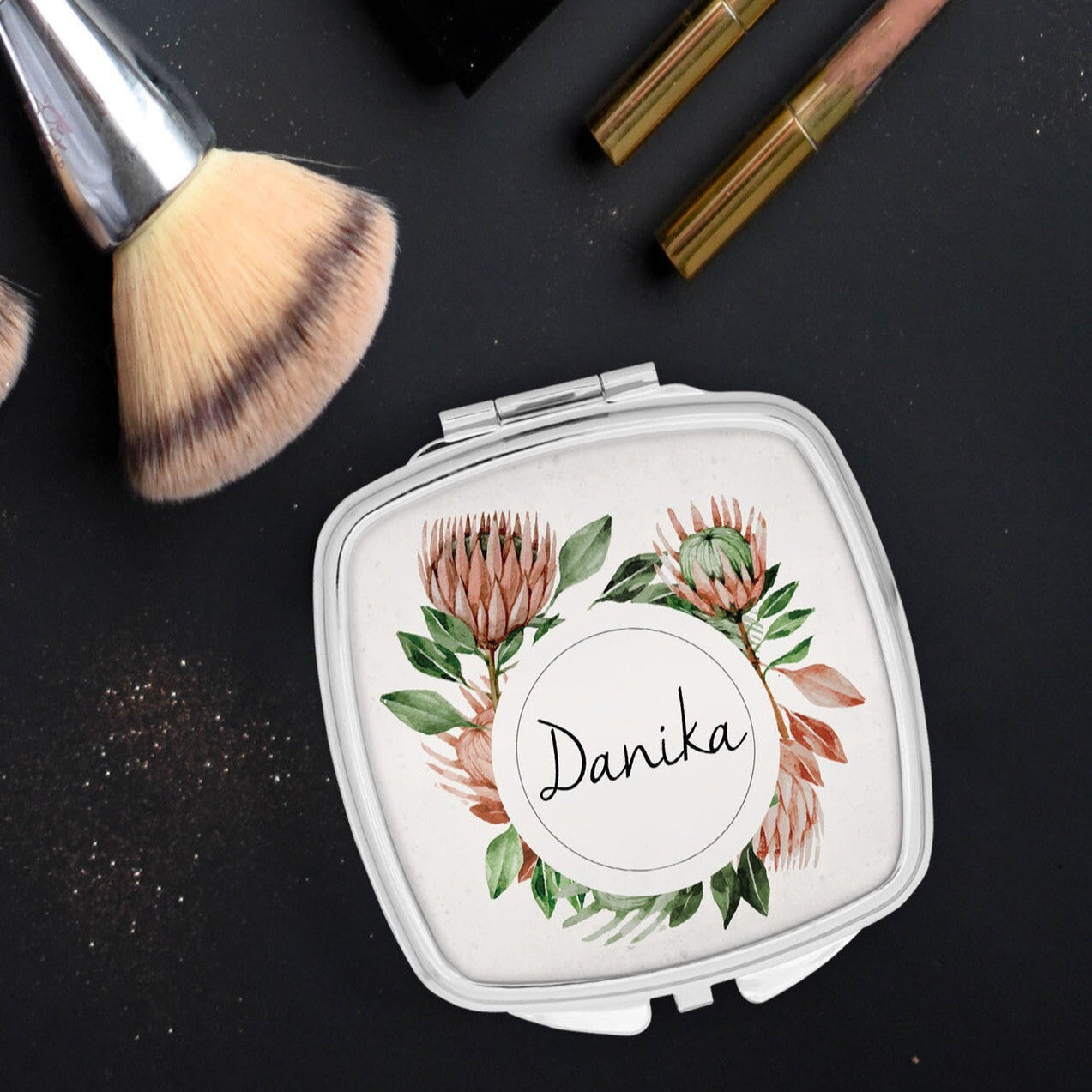 Personalised Pocket Mirror from Happy Look | South Africa – Adorned with South African floral designs and the name "Danika." Perfect for personal keepsakes and customisable with names. A thoughtful gift that brings joy and lasting memories. Shop now!