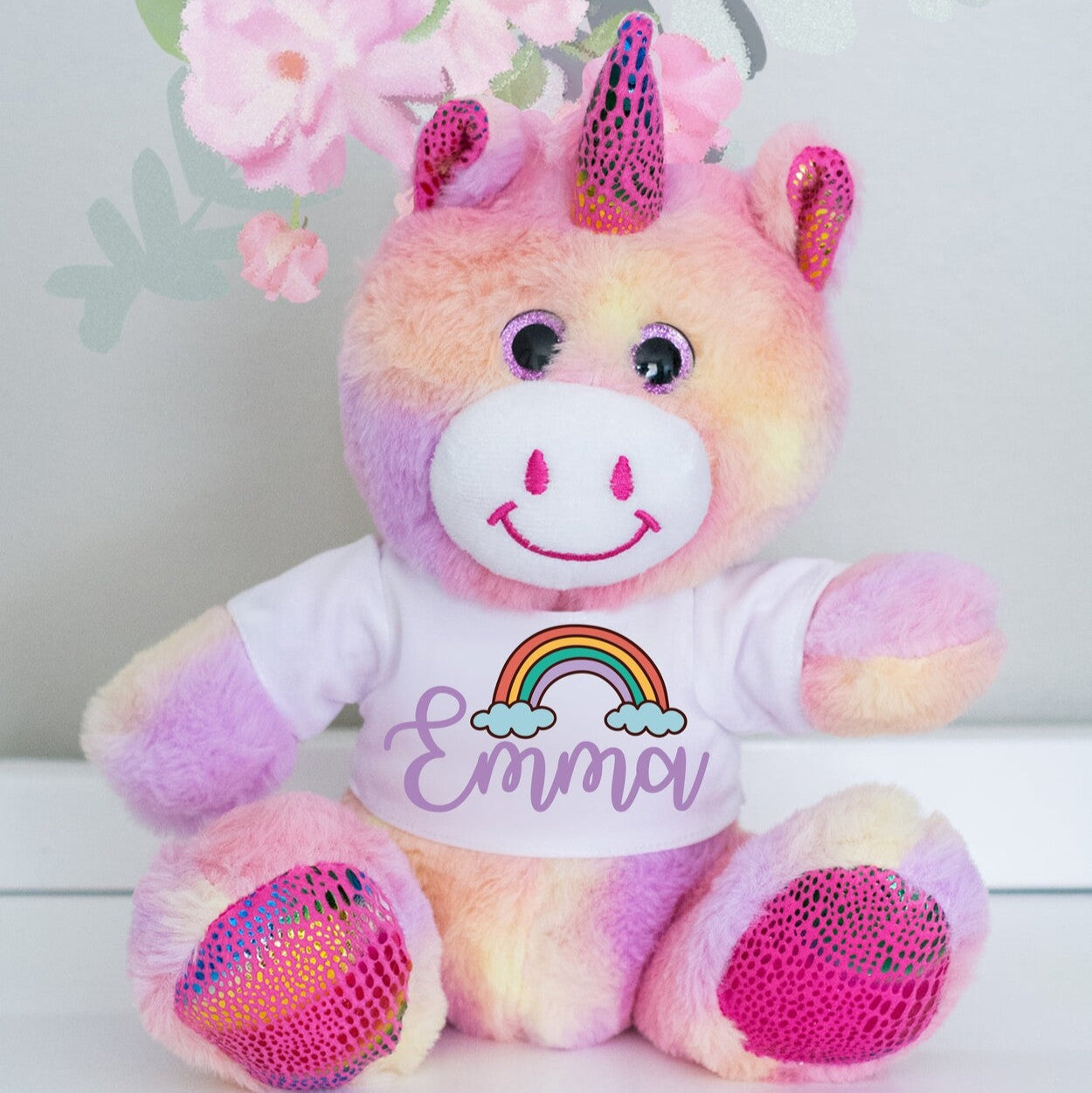 Personalised Unicorn Teddy from Happy Look | South Africa – Displays a t-shirt with the name "Emma" and a rainbow graphic.
Perfect for birthdays and special occasions and customisable with a name or personalisation. A thoughtful gift that brings joy and lasting memories. Shop now!
