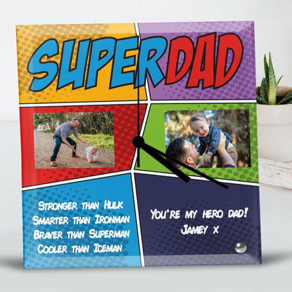 Square Glass Clock with a comic-style design featuring 'Super Dad' text. The clock includes two photos: a father helping a child walk and lifting the child joyfully. The text celebrates dad as a hero. Personalised Square Glass Clock from Happy Look | South Africa – A playful and heartwarming clock that honors fatherhood. Perfect for Father's Day, birthdays, or family celebrations, and customisable with your own personal message. A thoughtful gift that brings joy and lasting memories. Shop now!"