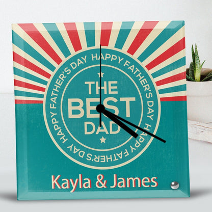 Square Glass Clock with a retro design featuring bold 'The Best Dad' text inside a starburst pattern. The names 'Kayla & James' appear below, creating an emotional and celebratory tone. Personalised Square Glass Clock from Happy Look | South Africa – A stylish and heartfelt clock to celebrate the best dad. Perfect for Father's Day, birthdays, or special occasions, and customisable with your own personal message. A thoughtful gift that brings joy and lasting memories. Shop now!